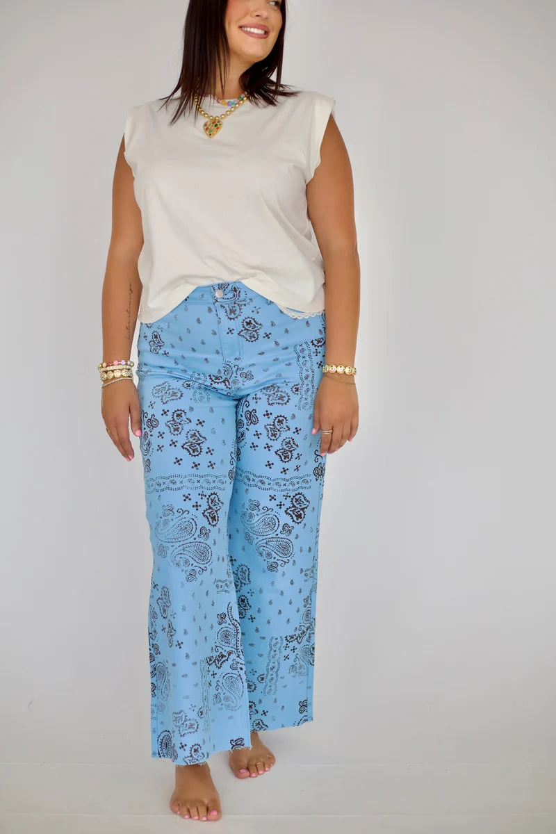 Light Blue Bandana Frey Hem Denim on model, front view, light blue bandana print, wide leg with frayed raw hem