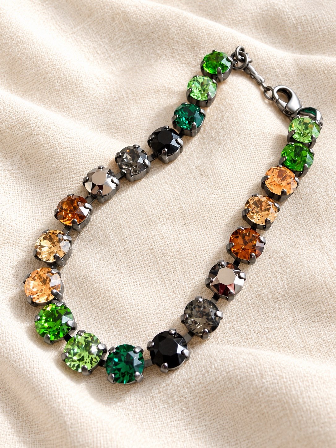 AF Designs Mood Swing Bracelet with multicolor crystals in dark green, black, amber, and gray in gunmetal settings