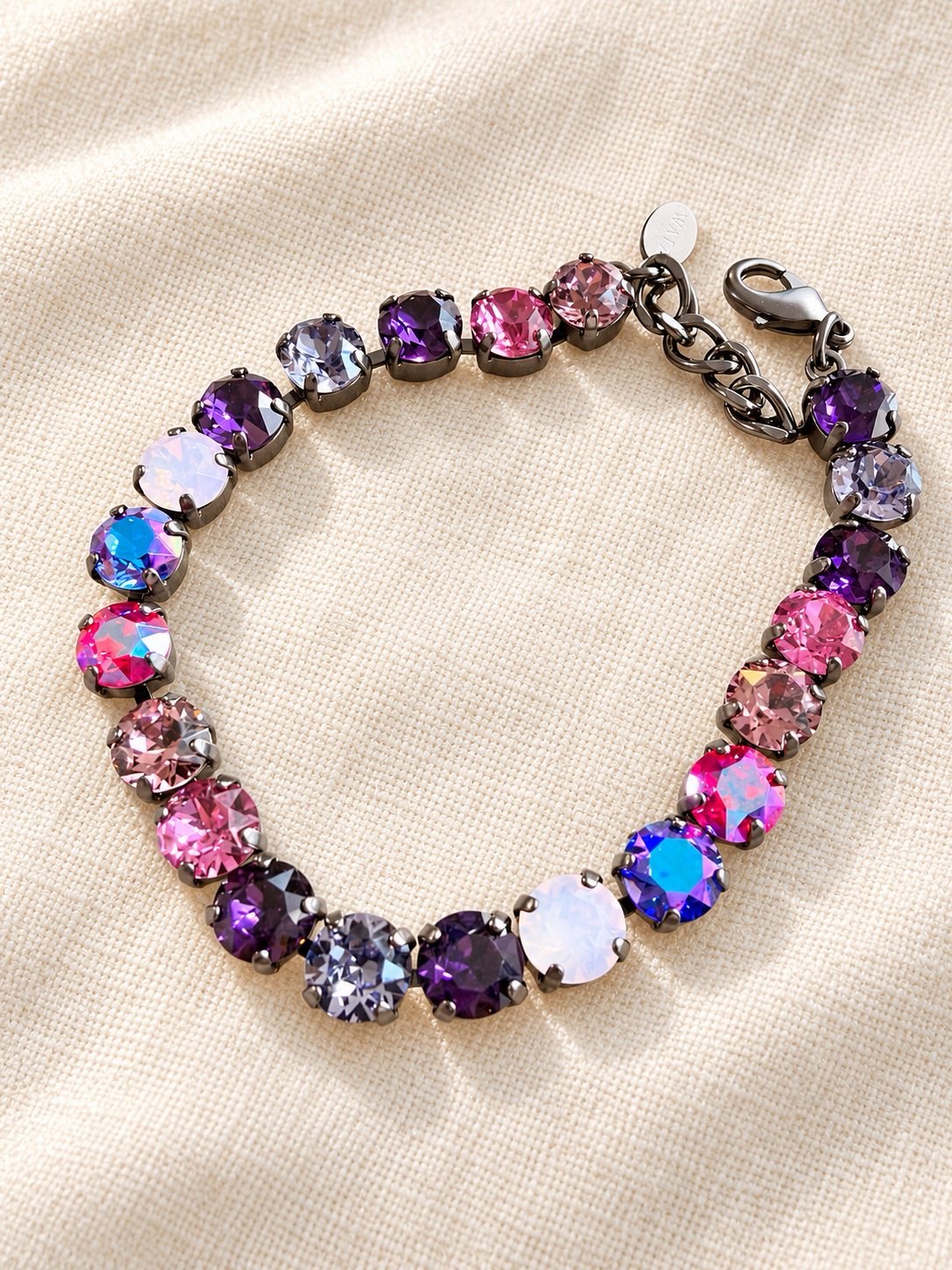 AF Designs Mood Swing crystal tennis bracelet in dark berry mix with purple, pink, and opal stones in gunmetal settings