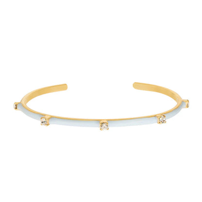 TOVA Everly gold cuff bracelet with light blue enamel and three crystal details on white background