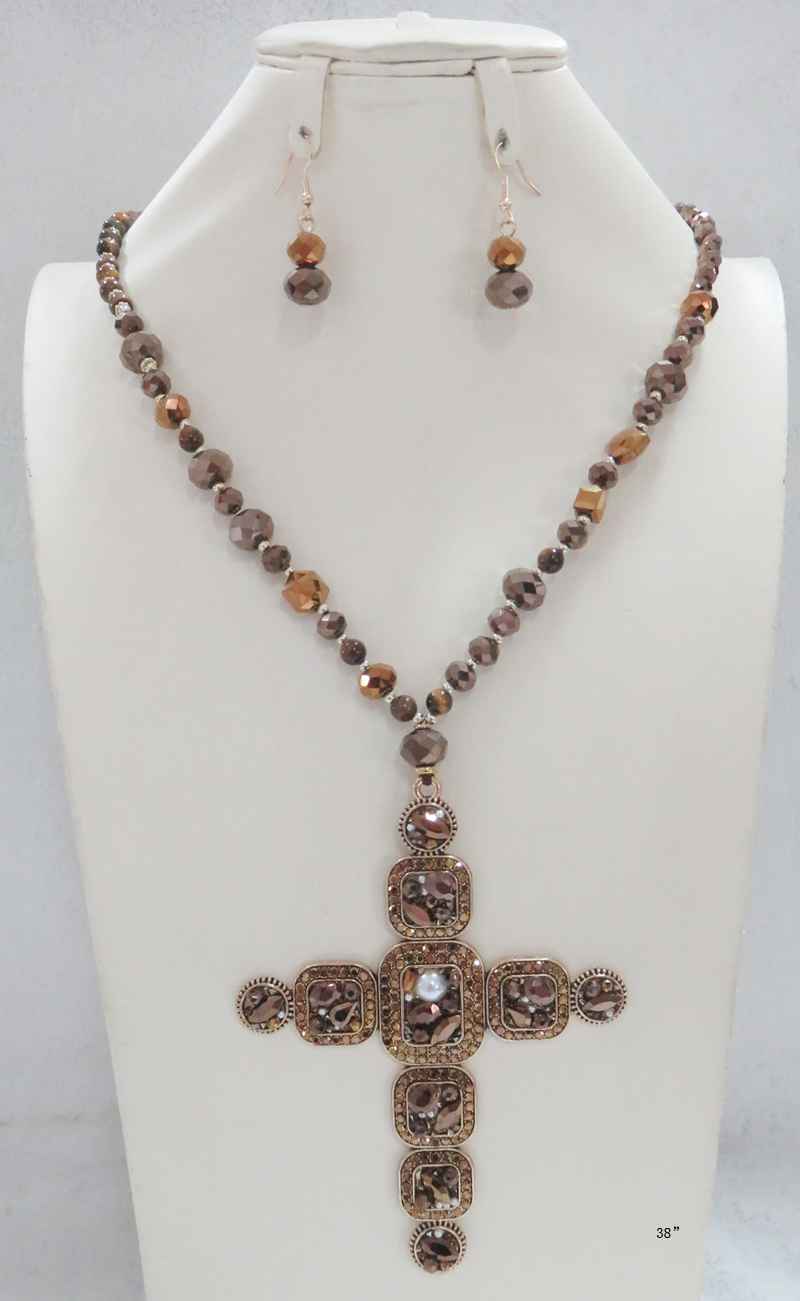 38-inch beaded crystal necklace with ornate antique gold cross pendant and matching drop earrings in brown tones