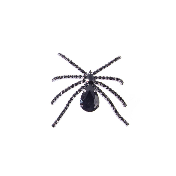 Black rhinestone spider brooch pin with teardrop gemstone abdomen and crystal-studded legs on white background