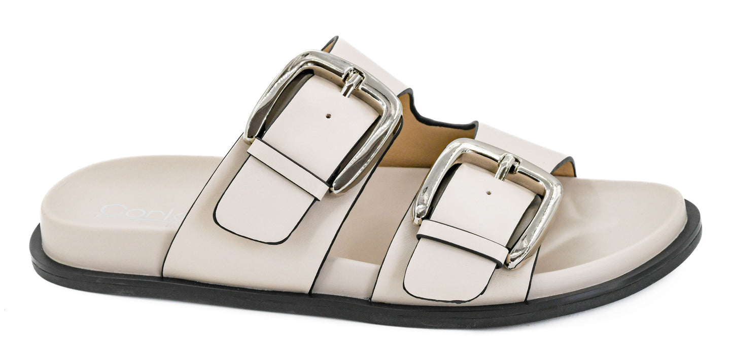 Corky's ivory leather slide sandals with dual silver buckle straps and flat sole