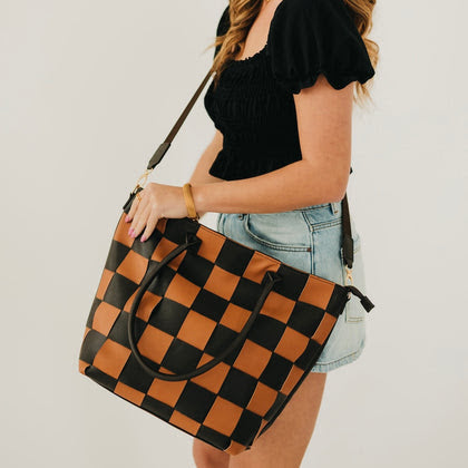 Large structured tote bag with black and coffee brown checkerboard pattern, dual handles, and adjustable crossbody strap