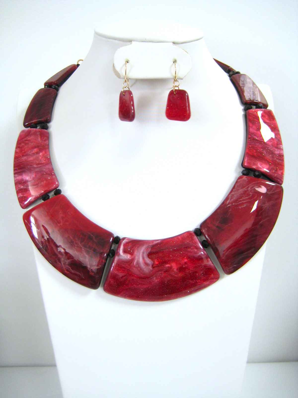Red marbled resin bib statement necklace set with matching drop earrings, deep crimson and burgundy tones