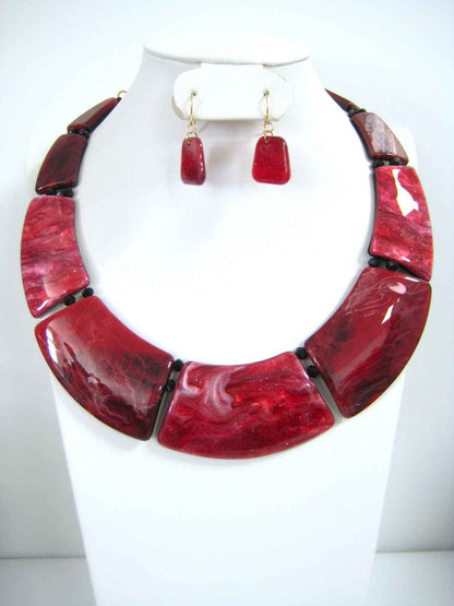 Red marbled resin bib statement necklace set with matching drop earrings, deep crimson and burgundy tones