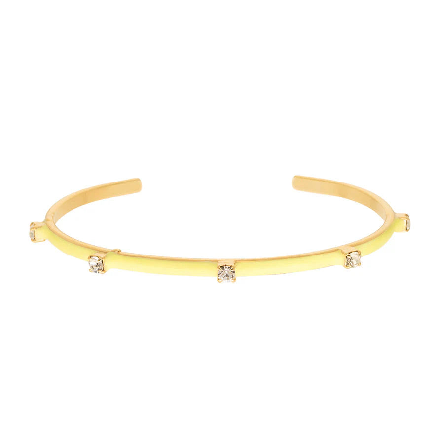 Gold cuff bracelet with four small crystal stones, open design, minimalist style