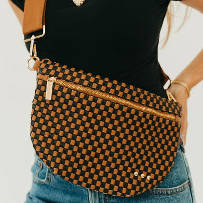 Pretty Simple Westlyn woven bum bag in black and coffee checkered pattern with gold hardware, worn crossbody.
