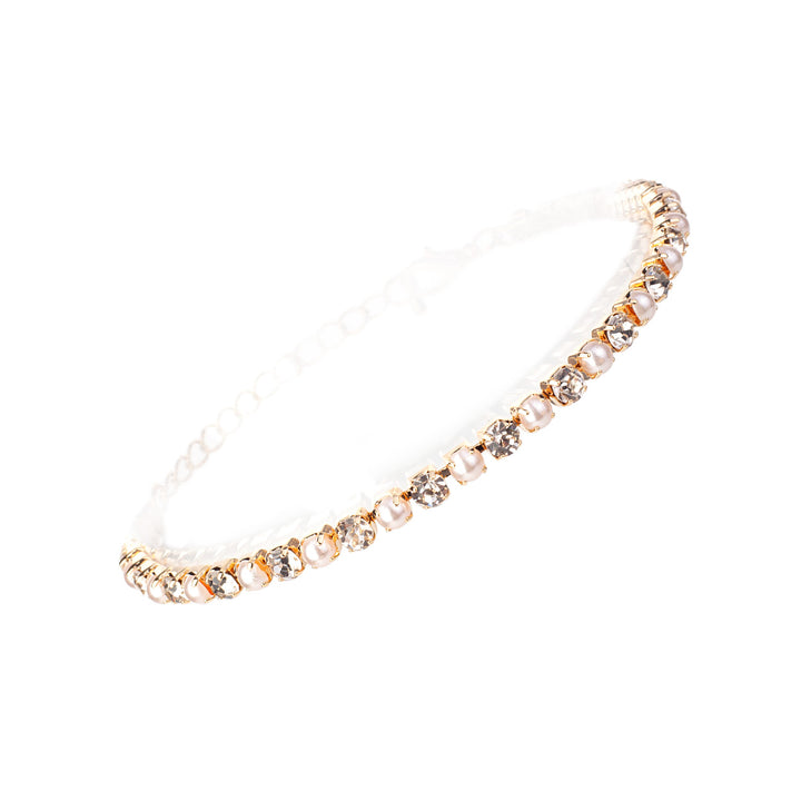 Gold stretch bracelet alternating cream pearl and clear crystal rhinestones in prong settings, elegant bridal style