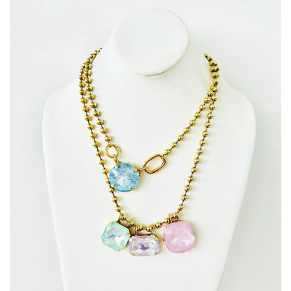 TOVA Whimsey layered gold necklace with blue, mint, lavender and pink crystal pendants on ball chain