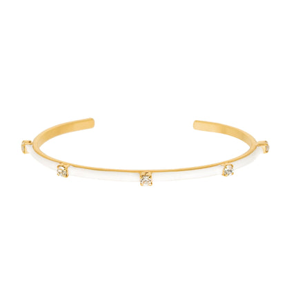 Gold cuff bracelet with three dangling white crystal charms on thin band
