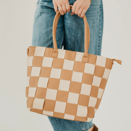 Pretty Simple Courtney woven checkered tote bag in tan and cream with dual handles, checkerboard pattern.