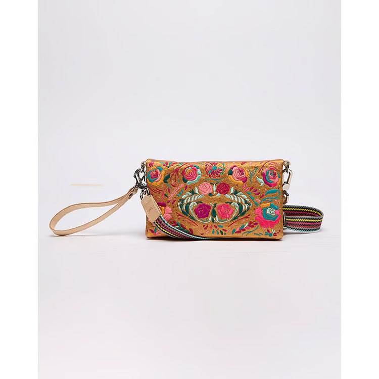 Consuela Uptown Crossbody in Bronzer with colorful floral embroidery, leather wrist strap, and striped crossbody strap.