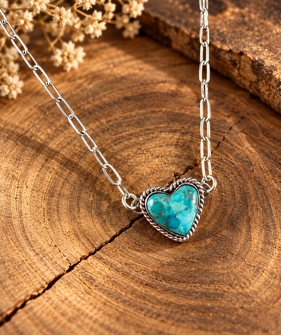 Boho Sol Turquoise Sweetheart Necklace, a turquoise heart with a twisted rope border on a sterling paperclip chain
