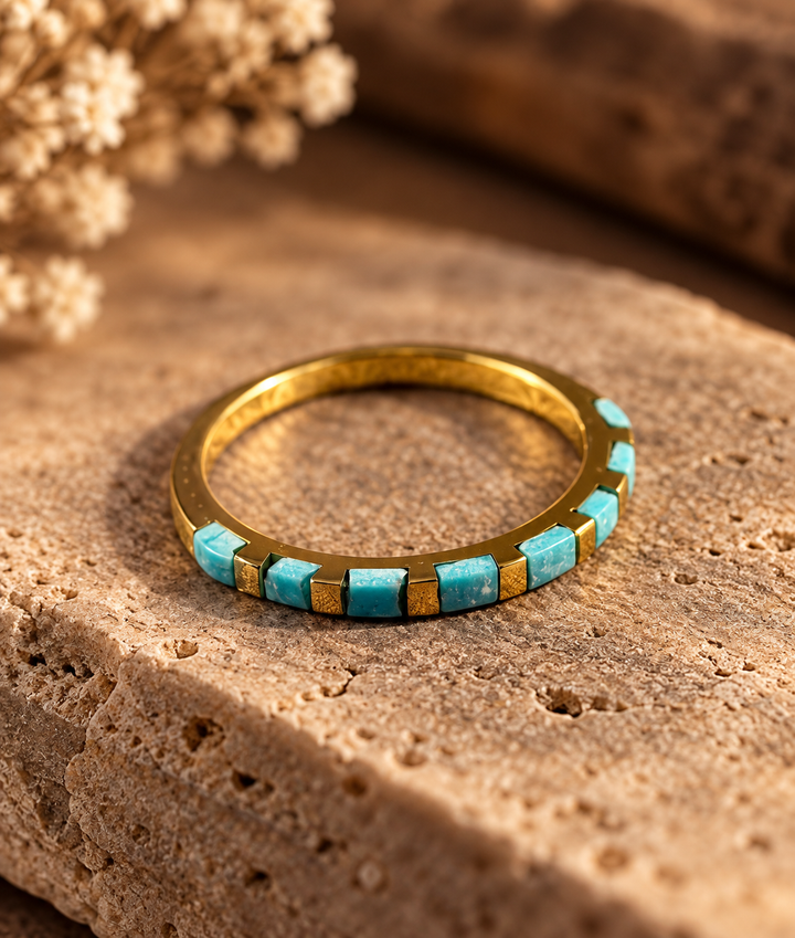 Boho Sol Turquoise Trail Ring, a thin gold-tone band with small turquoise squares across the front