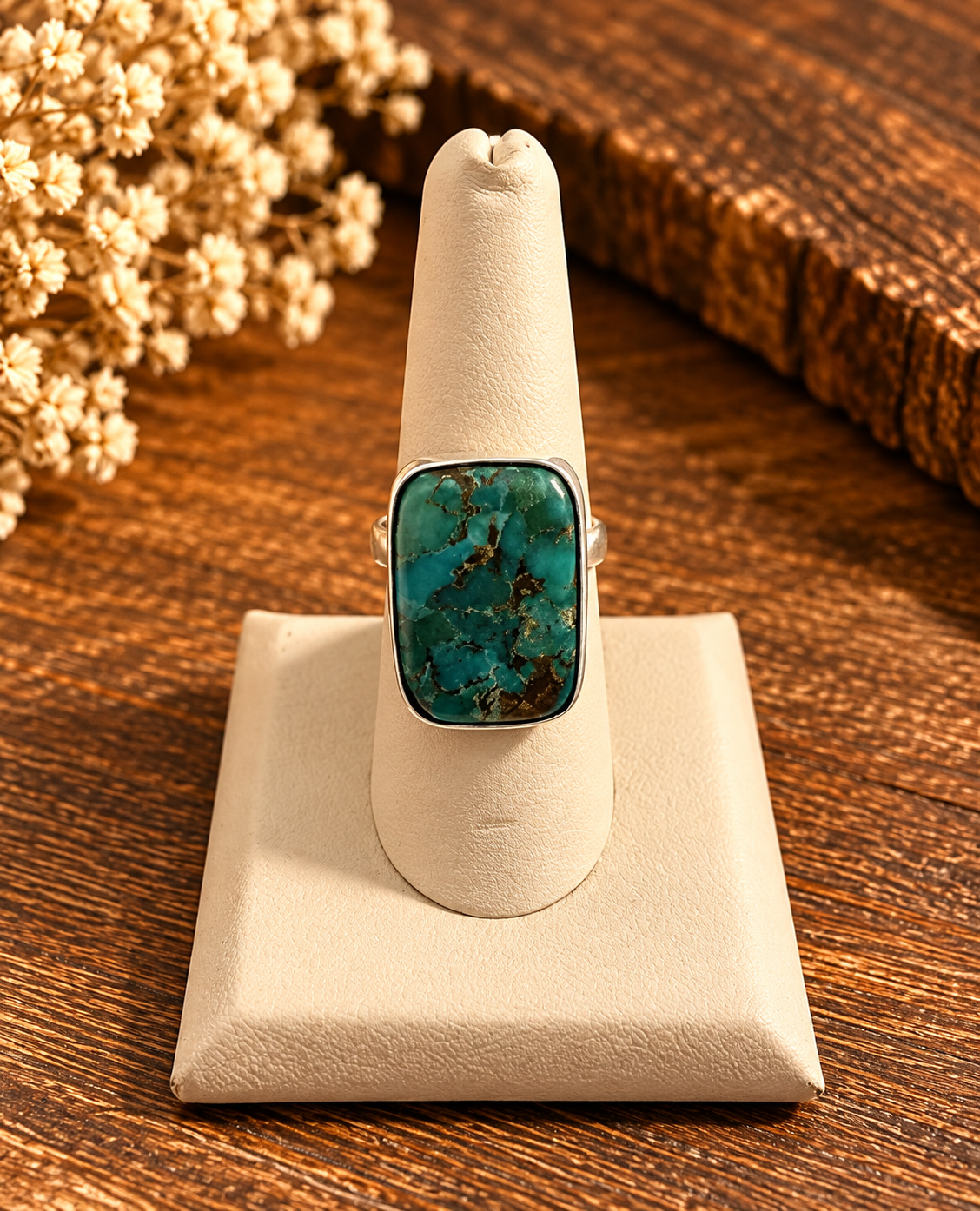 Boho Sol Western Love Ring, a large rectangle blue-green turquoise stone with brown veining in a smooth sterling setting